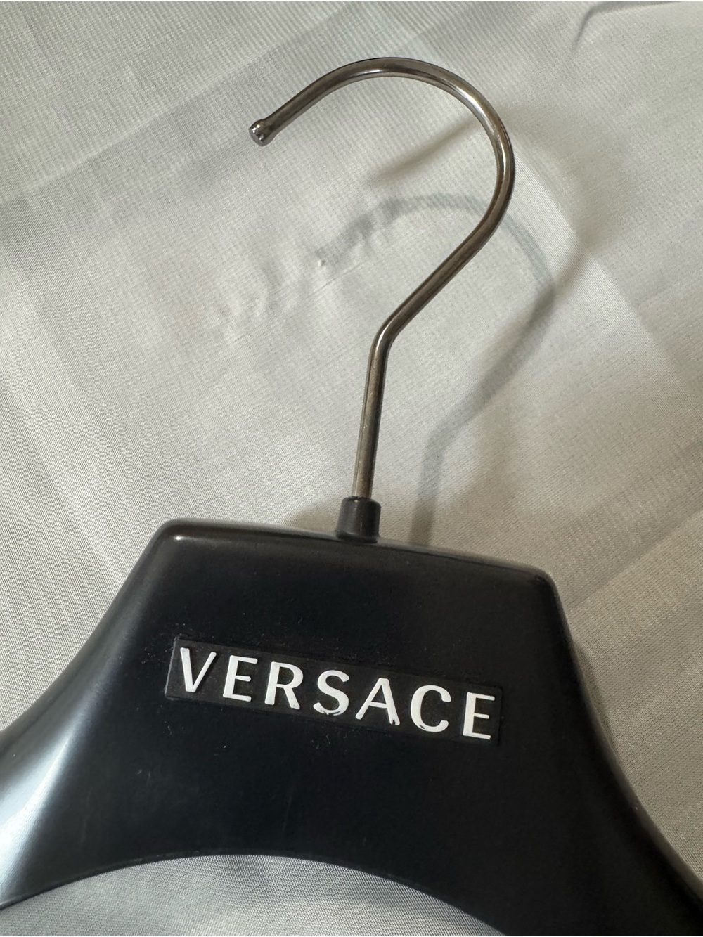 Versace 💯% Authentic Black Plastic Hanger with Iconic Branding White Logo.
